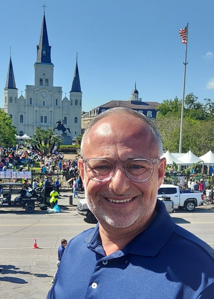 Paul stands in front of the cathedral